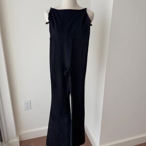 Aritzia divinity jumpsuit kick flare in black influencer XS Pilates princess
